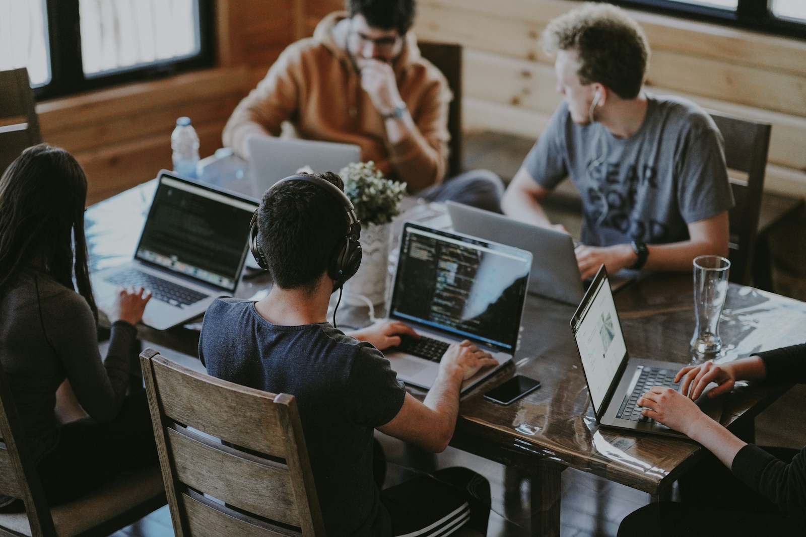 A product team reviewing work together around a table